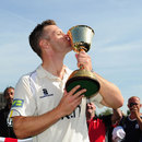 Jim Troughton kisses the trophy after Warwickshire's Championship win