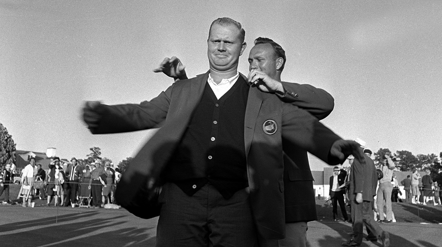 Jack Nicklaus receives the green jacket from Arnold Palmer