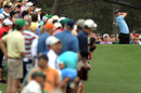 Justin Rose tees off as patrons watch