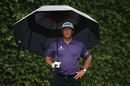 Phil Mickelson hides from the elements