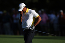 Tiger Woods recoils after finding water