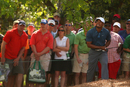 Tiger Woods hacks off the pine straw