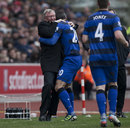 Robin van Persie celebrates with Sir Alex Ferguson after scoring a penalty 