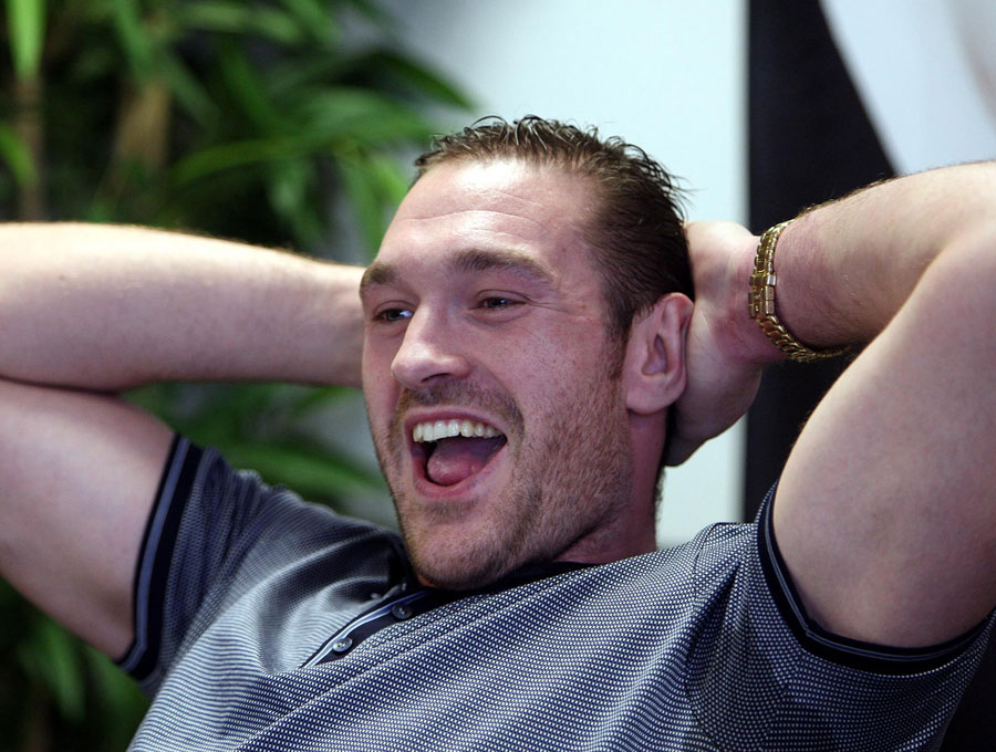 Tyson Fury relaxes during a press conference