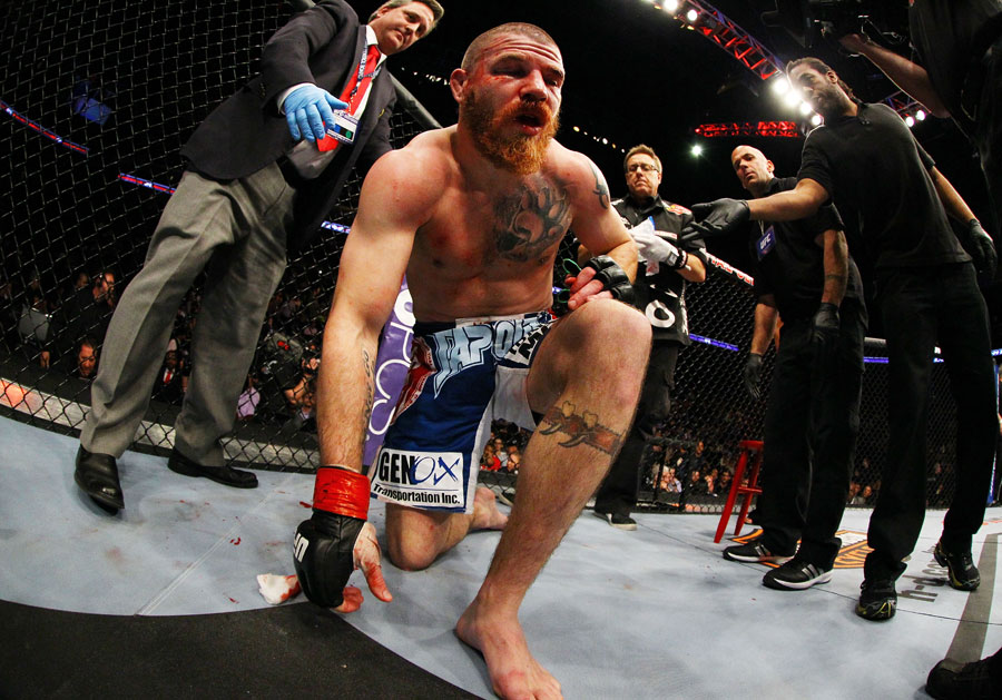 Jim Miller stands up after losing by rear naked choke to Pat Healy