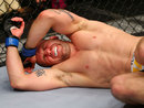 Alan Belcher reacts after being poked in the eye by Michael Bisping