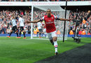 Theo Walcott celebrates his early goal against Manchester United