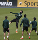 Cristiano Ronaldo heads a ball in training