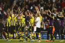 Borussia Dortmund players cheer with their fans