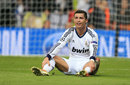 Cristiano Ronaldo sits on the pitch dejected