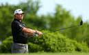 Lee Westwood watches his shot