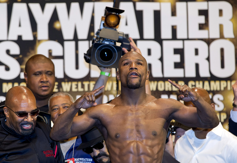 Floyd Mayweather Jr completes the weigh-in
