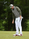Rory McIlroy watches his missed putt