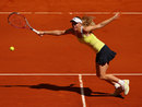 Caroline Wozniacki stretches for a forehand against Yaroslava Shvedova