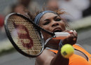 Serena Williams powers into a forehand