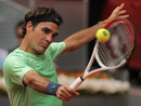 Roger Federer concentrates on a backhand