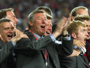Sir Alex Ferguson celebrates winning the treble