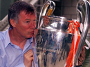 Sir Alex Ferguson kisses the Champions League trophy