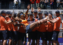Serena Williams is congratulated by ball boys and girls
