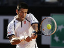 Novak Djokovic concentrates on a backhand