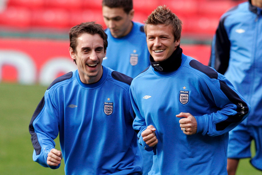 England's Gary Neville and David Beckham sharing a joke during training
