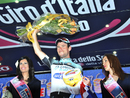 Mark Cavendish celebrates on the podium