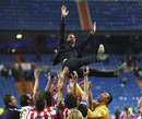 Atletico Madrid players celebrate with coach Diego Simeone