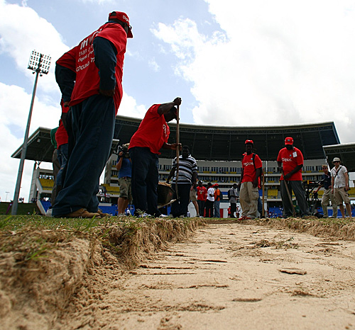 Groundsmen dig beneath the surface of the Antigua pitch and find a sandpit