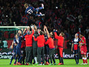 David Beckham is thrown into the air by his Paris Saint-Germain team-mates