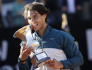 Rafael Nadal bites the trophy