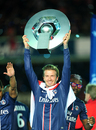 David Beckham lifts the Ligue One trophy