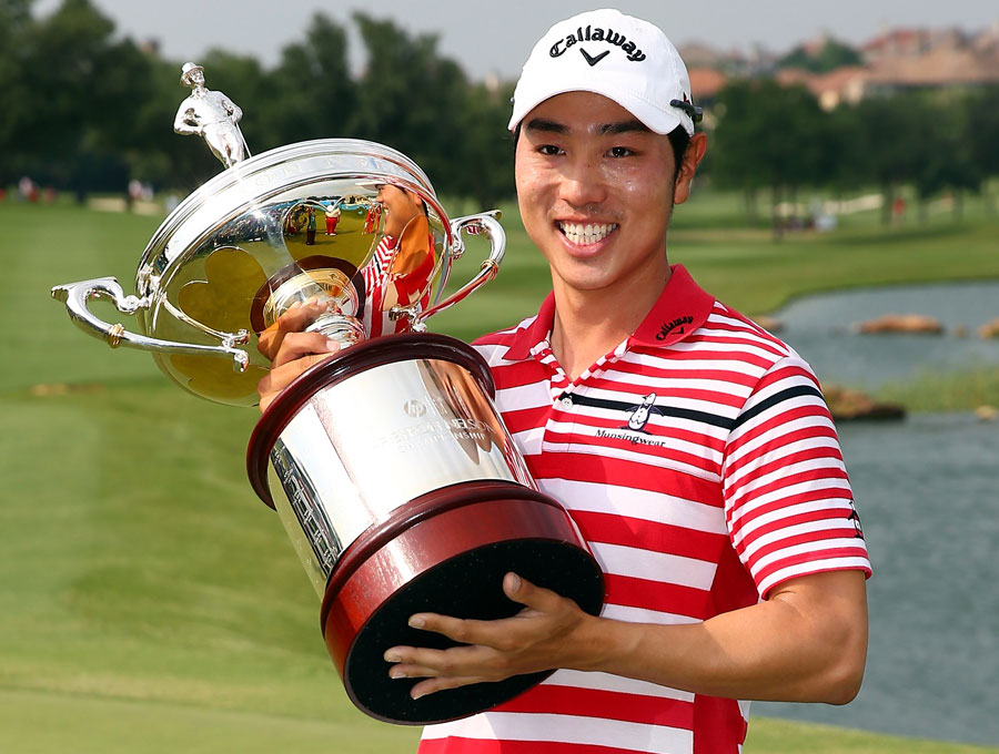 Sang-Moon Bae celebrates with the championship trophy