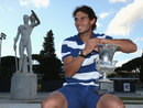 Rafael Nadal poses in front of the statues of Pietrangeli court