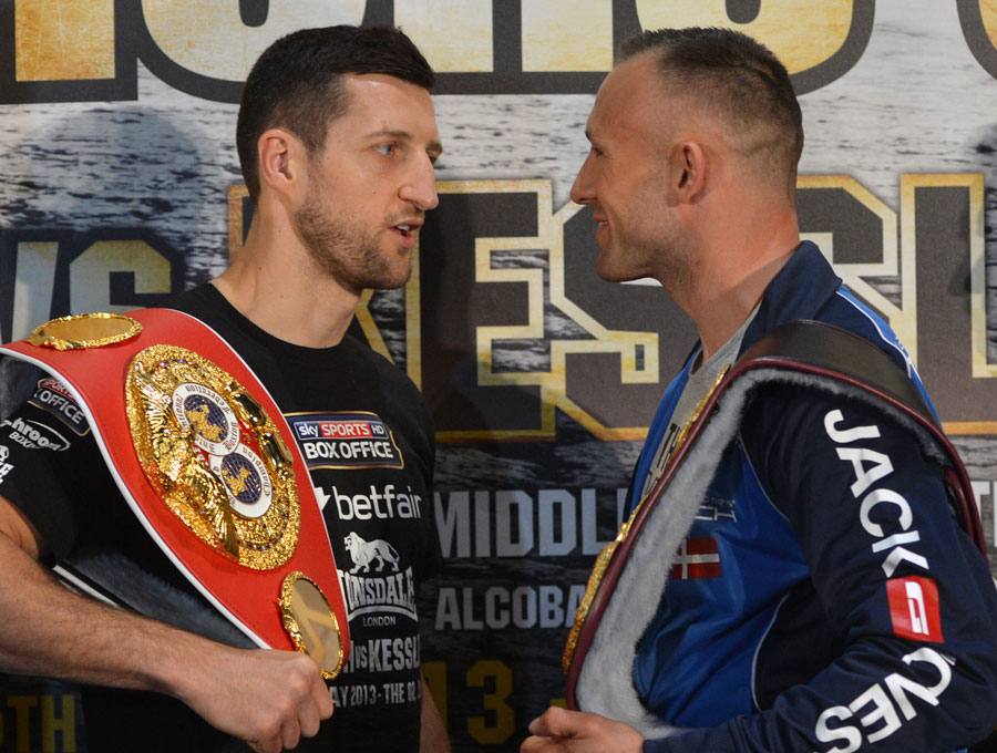 Carl Froch exchanges words with Mikkel Kessler during a press conference