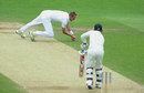 Stuart Broad stoops to catch Brendon McCullum