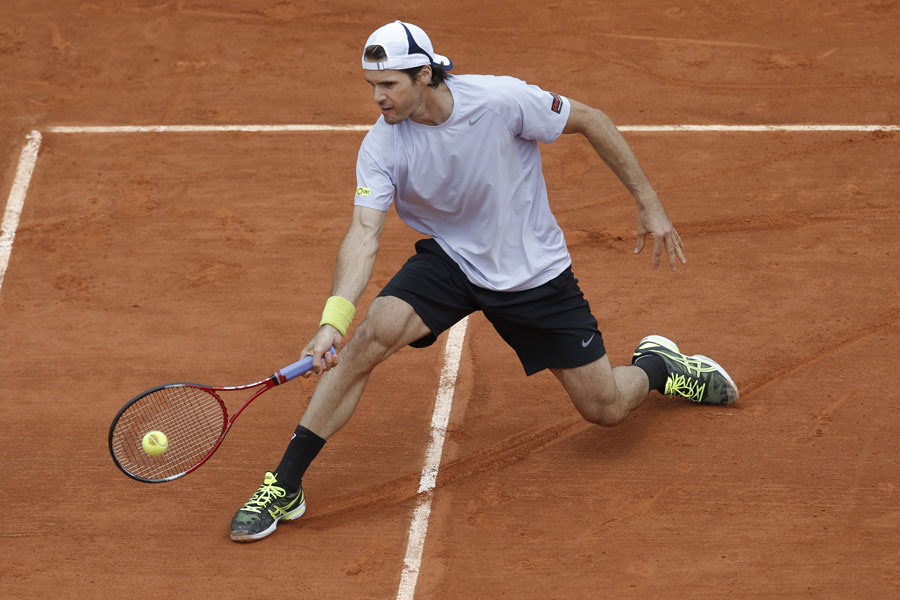Tommy Haas slides on court