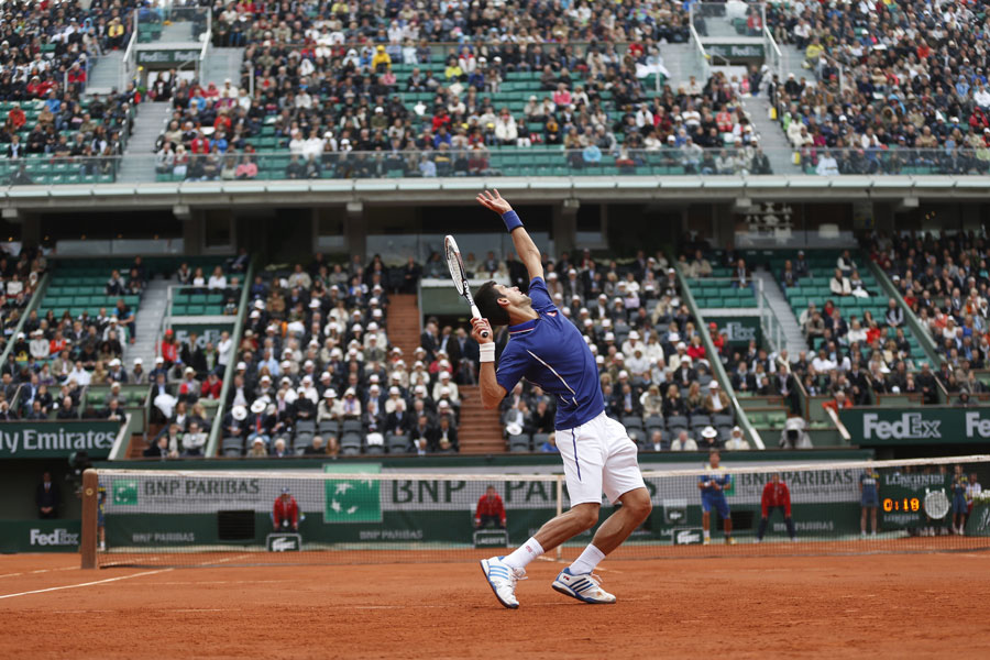 Novak Djokovic hits a serve