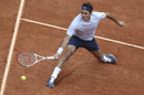 Roger Federer slides gracefully on court