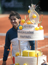 Rafael Nadal poses with his birthday cake