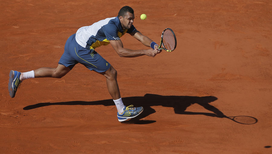 Jo-Wilfried Tsonga stretches for a shot