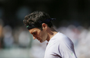 Roger Federer stands dejected
