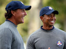 Phil Mickelson and Tiger Woods share a joke