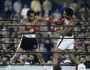 Muhammad Ali evades a punch from Ken Norton