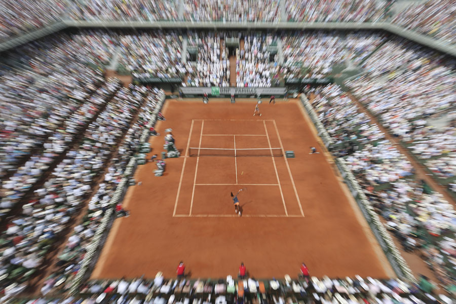 A wide view of Serena Williams and Maria Sharapova in action