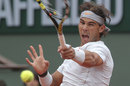 Rafael Nadal fires a forehand