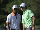 Tiger Woods and Rory McIlroy study the greens