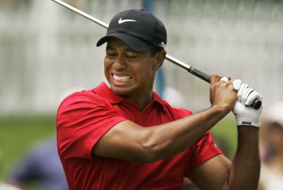 Tiger Woods winces in pain