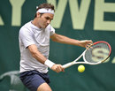 Roger Federer slices the ball