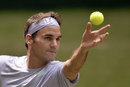 Roger Federer prepares for a serve