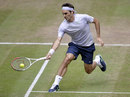 Roger Federer sweeps to a forehand